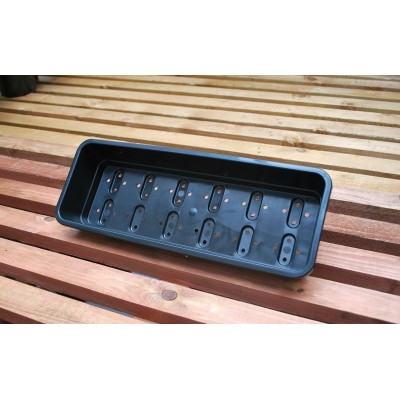 Bac à semis étroit noir avec trous